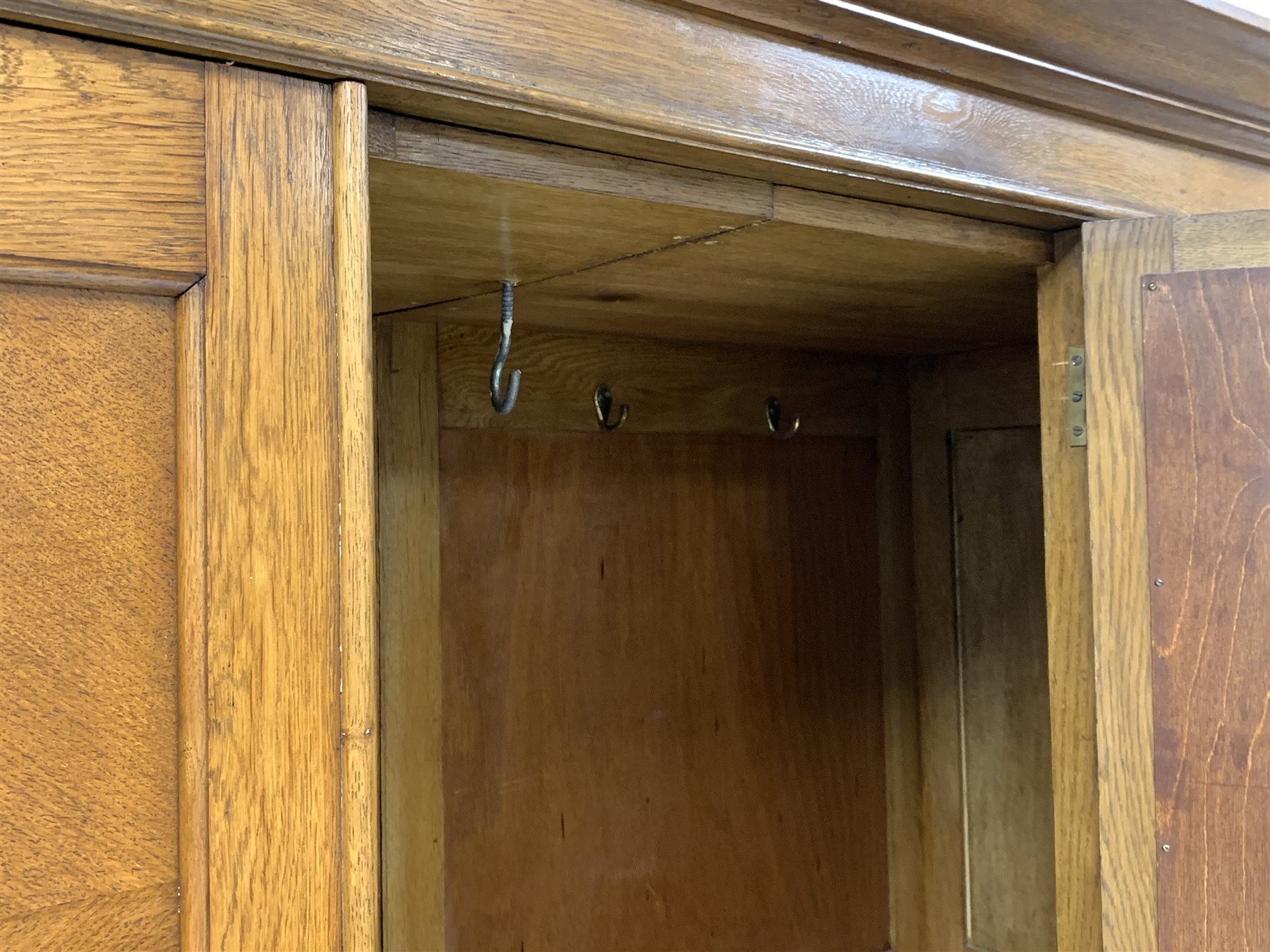 Early 20th century panelled oak wardrobe, projecting cornice over single bevel edged mirror glazed d - Image 2 of 5