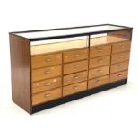 20th century teak haberdashery shop display cabinet, glazed display top, one side fitted with sixtee