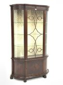 Early 20th century mahogany break bow front display cabinet, astragal glazed door enclosing three gl
