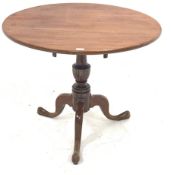 Georgian mahogany tripod table, circular tilt top on turned vase shaped column with three out splaye