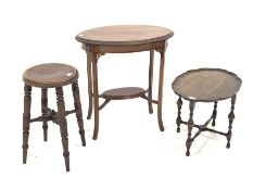 Edwardian mahogany centre table, oval gadroon moulded top, outsplayed supports connected by under ti