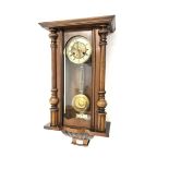 Late 19th century walnut and beech cased Vienna wall clock, twin train movement striking on coil, wi