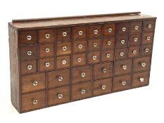Victorian mahogany chemists apothecary chest fitted with thirty nine drawers each with moulded glass