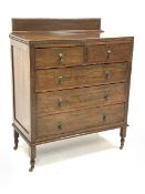 Early 20th century oak chest, two short and three long drawers, on turned supports with castors, W99