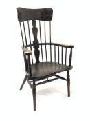 Early 20th century dark oak Windsor style armchair, with spindle back and floral carved splat and sw