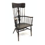 Early 20th century dark oak Windsor style armchair, with spindle back and floral carved splat and sw