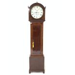 Early 19th century mahogany longcase clock, the arched hood with three turned finials over cross ban