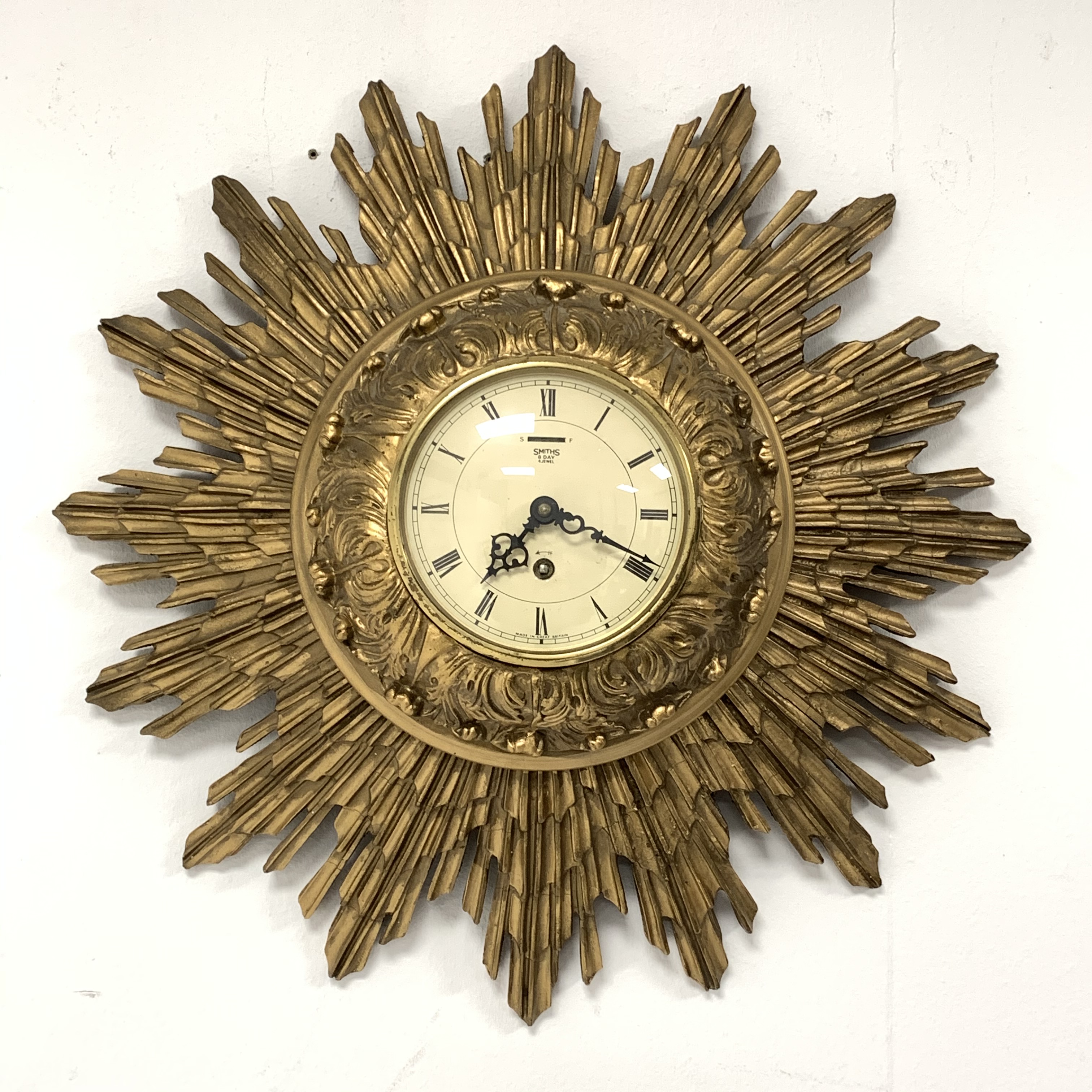 Smiths giltwood starburst wall clock, with white enamel dial and Roman numeral chapter ring, eight d