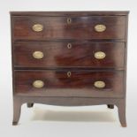 Regency mahogany chest fitted with three long graduated drawers, raised on splayed bracket supports,