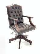 20th century captains chair, seat and back upholstered in buttoned and studded brown leather, open a