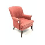 Edwardian upholstered easy chair, with loose cushion, swept arms, raised on walnut square splayed su