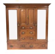 Edwardian walnut triple wardrobe, dentil cornice over two inlaid panelled doors and three graduated