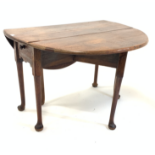 Georgian oak and elm oval drop leaf table, with gateleg action, drawer to one end over shaped apron,