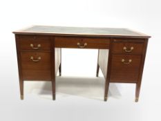 20th century mahogany twin pedestal desk, skivered top over one long drawer, two skivered slides and