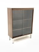 1970s hardwood glazed bookcase, with two sliding doors enclosing two adjustable shelves, raised on b