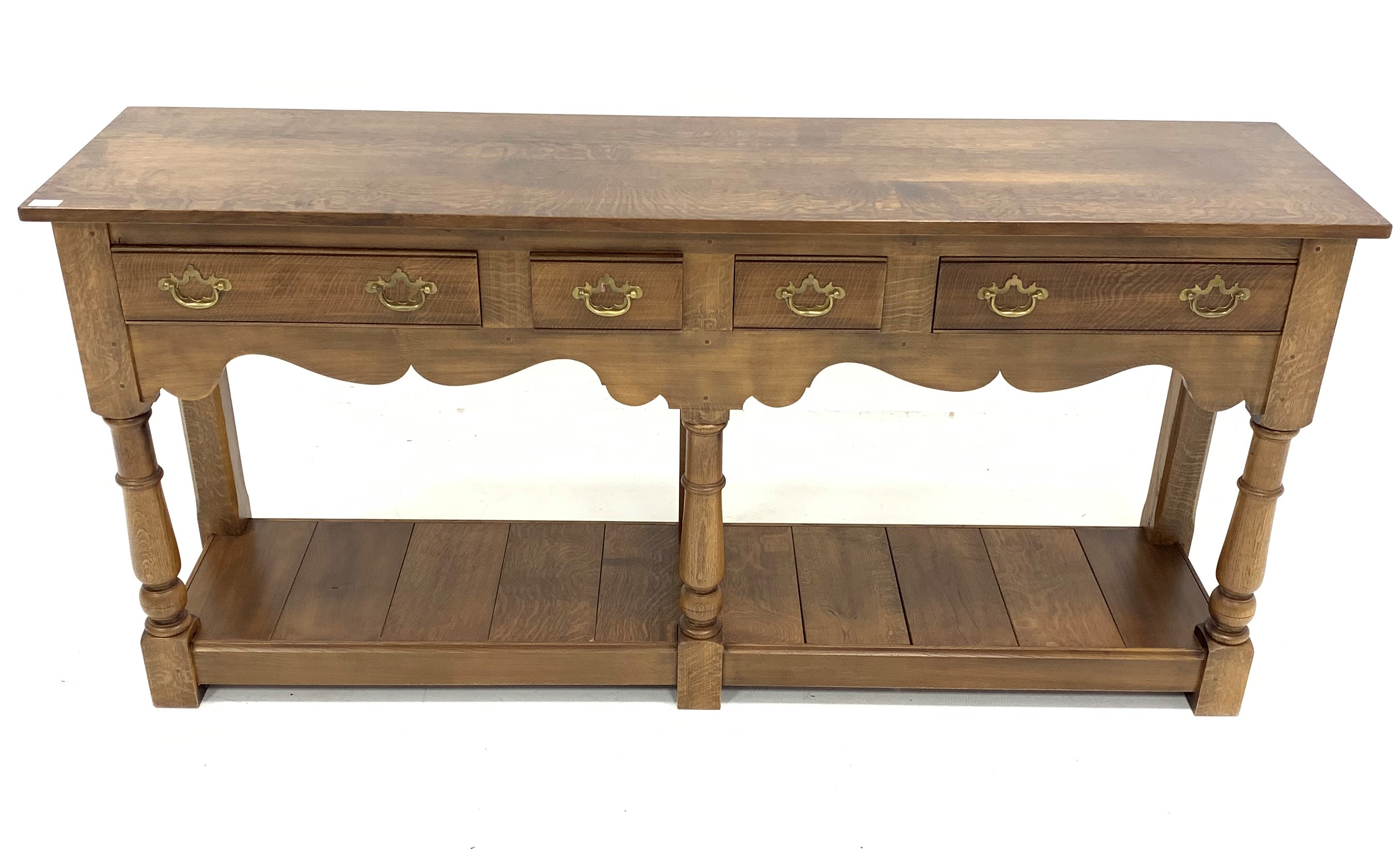 18th century style solid oak dresser, with two short and two longer drawers, shaped apron, turned an