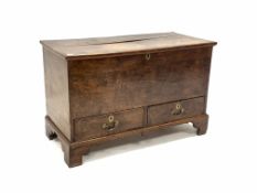 Late 19th century oak mule chest, the hinged lid over two drawers, raised on shaped bracket supports