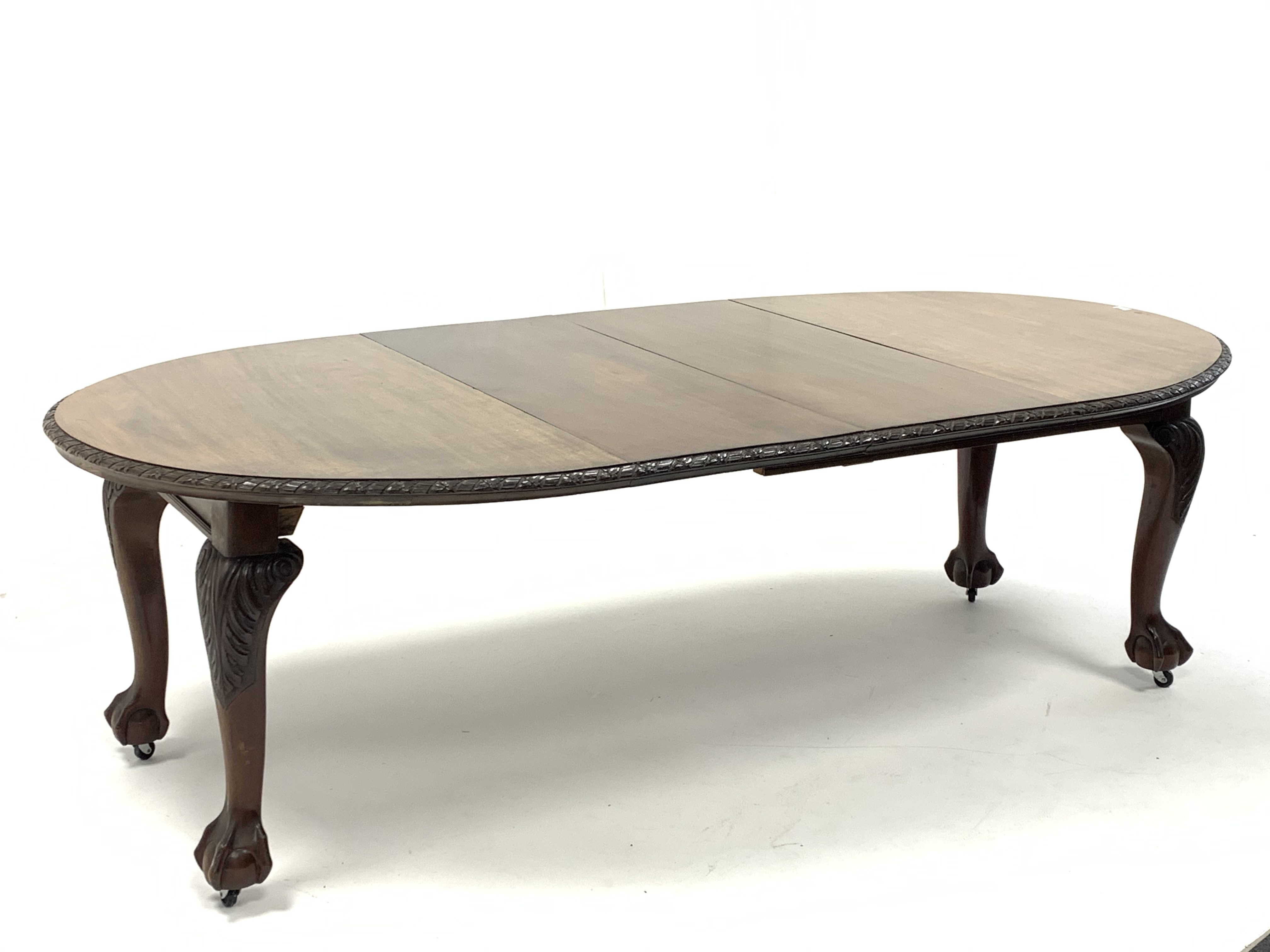 Early 20th century mahogany extending dining table, the oval top with floral edging over acanthus ca - Image 2 of 5