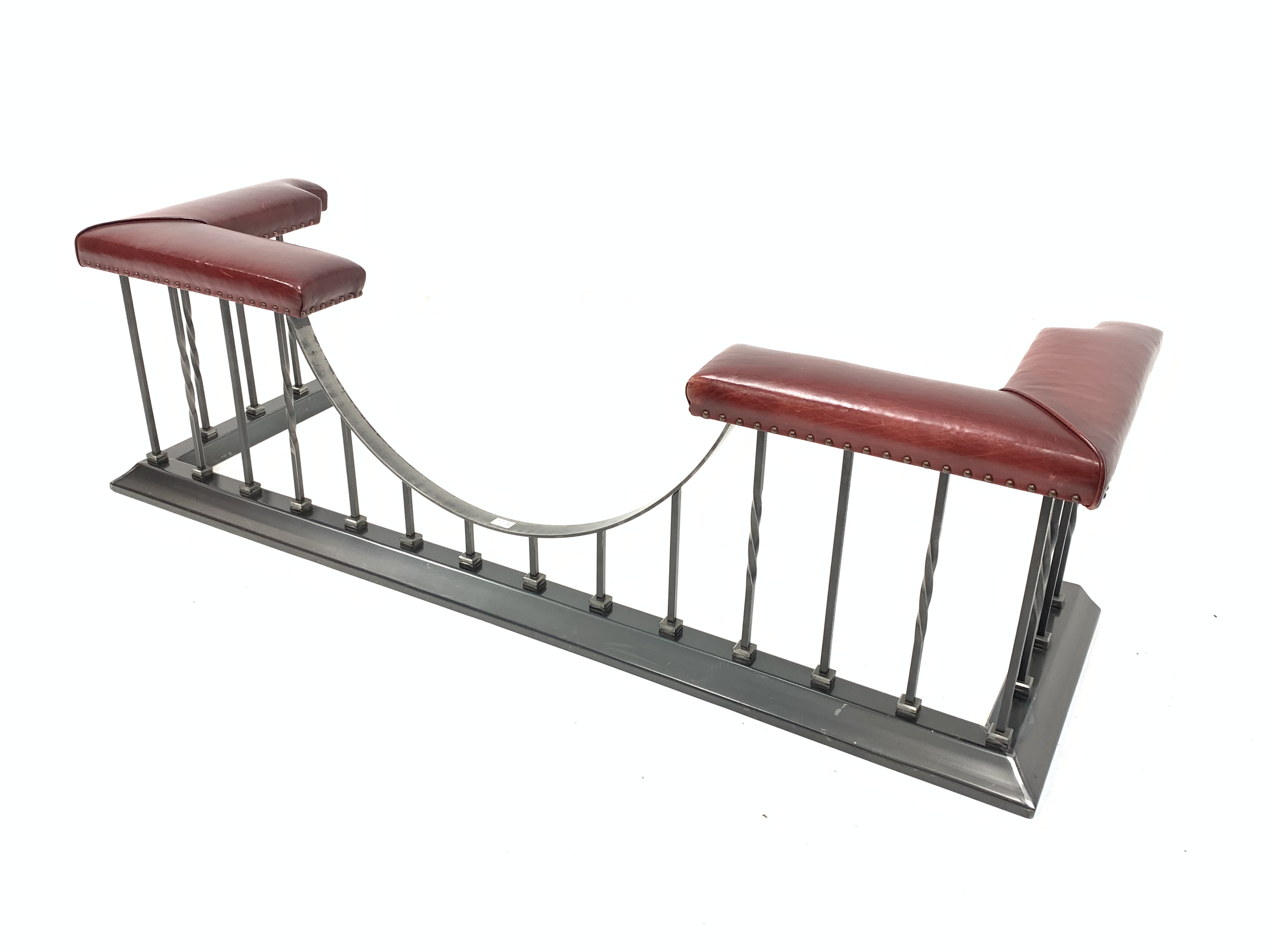 Victorian style wrought metal club fender, with two leather upholstered seats to each end, W180cm, H