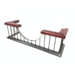 Victorian style wrought metal club fender, with two leather upholstered seats to each end, W180cm, H