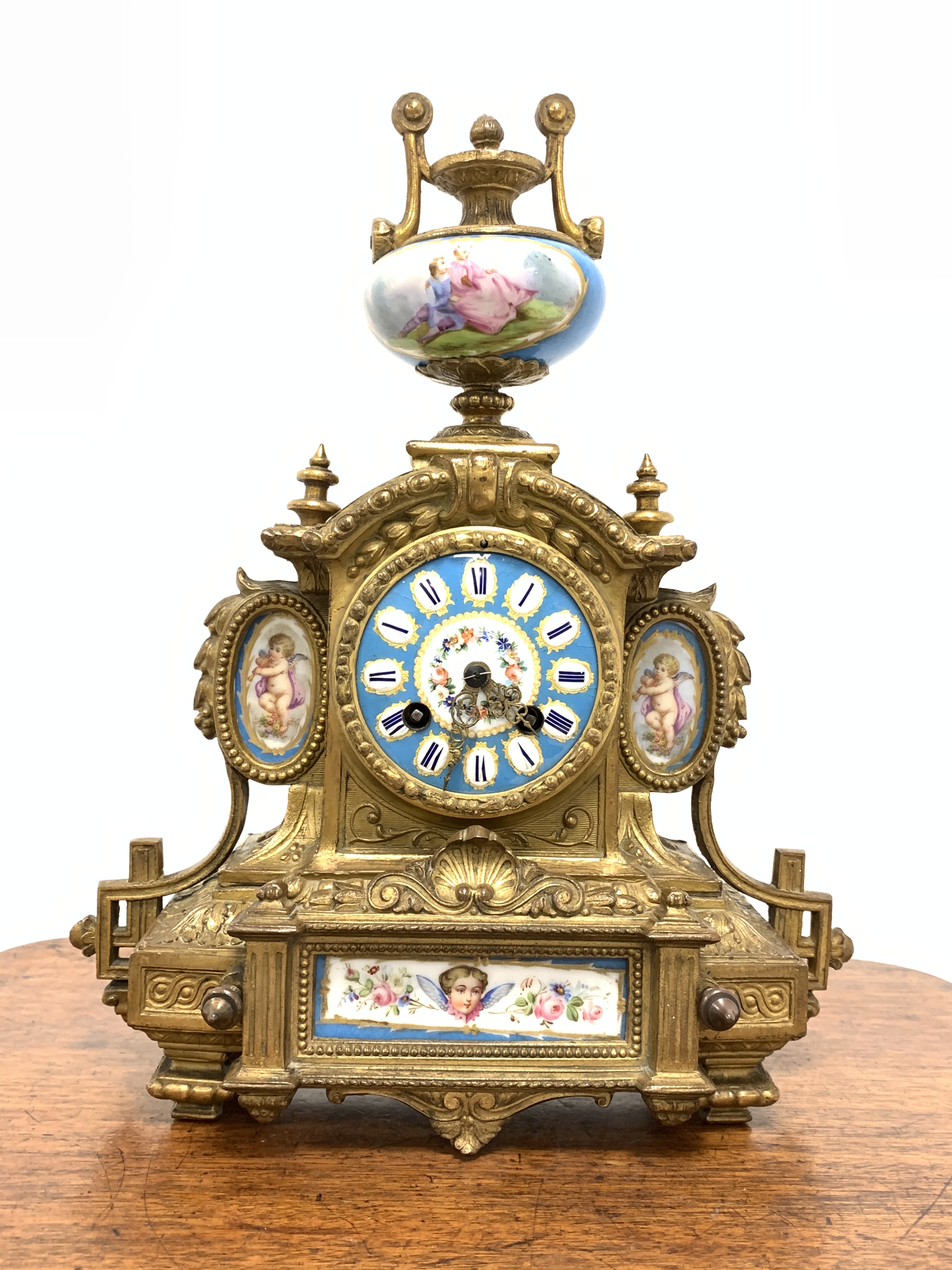 19th century French brass mantel clock with Severus porcelain panels, surmounted by urn finial, eigh