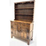 18th century style medium oak dresser, with two height plate rack over two drawers and two lunette c