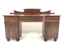William IV mahogany break bow front sideboard, with raised back over three drawers and two panelled