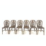Set six late 19th century beech and ash hoop and spindle back chairs with saddle seats, raised on ri