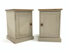 Pair of painted pine bedside cupboards, with panelled door enclosing single shelf, W40cm, H57cm, D40