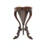 Victorian walnut and rosewood work table of trumpet form, the top lifting to reveal paper and silk l