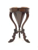 Victorian walnut and rosewood work table of trumpet form, the top lifting to reveal paper and silk l