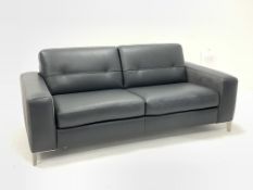 Contemporary three seat leather sofa bed upholstered in charcoal grey leather, raised on angular bru