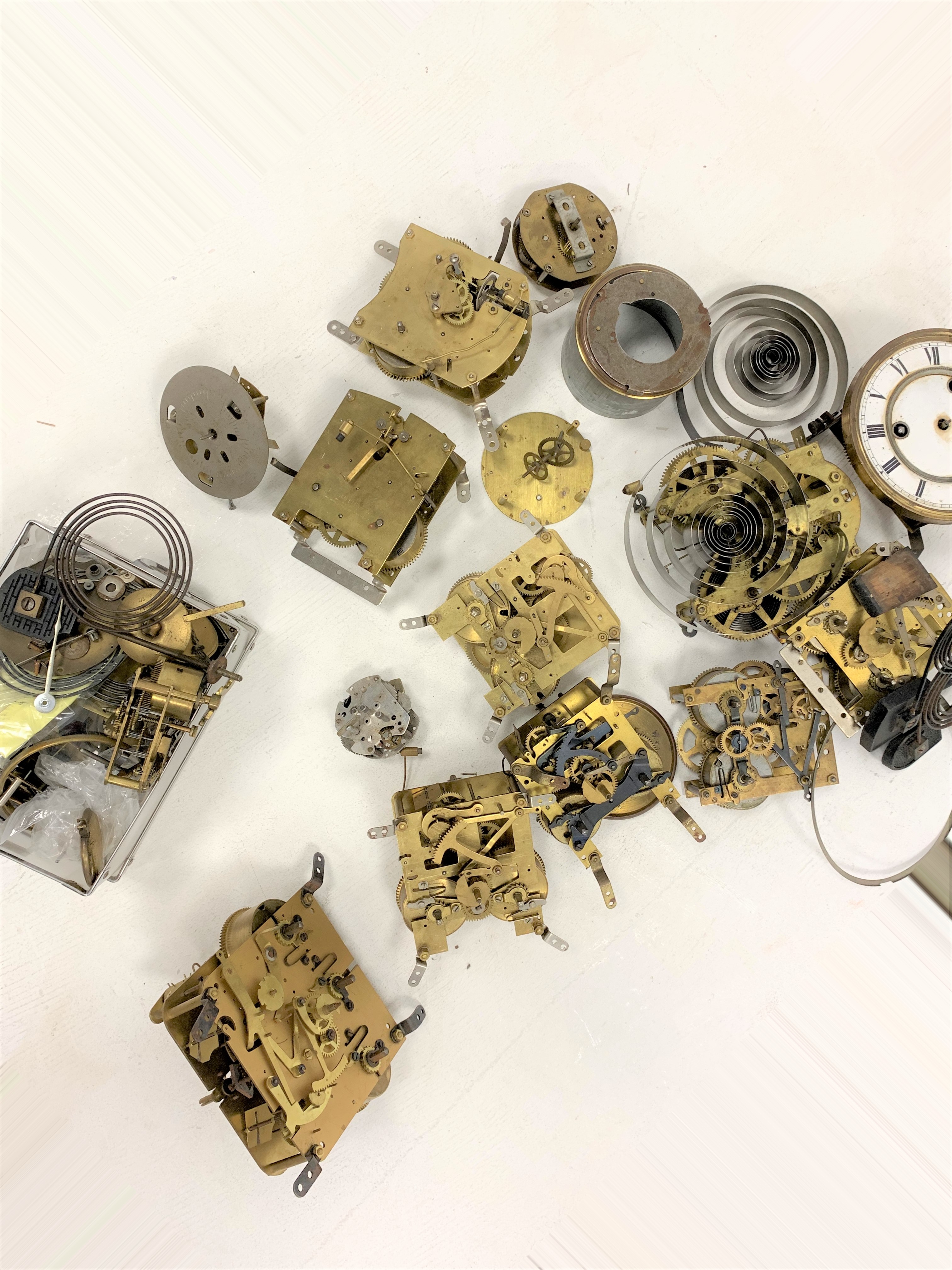 Box of various mantel clock movements, including Smiths, and other various clock parts,