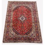 Persian fine Kashan red ground carpet, with floral medallion on red field with interlaced foliate, t