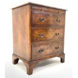 George III style walnut chest, with cross banded top over brushing slide and three long graduated dr