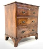George III style walnut chest, with cross banded top over brushing slide and three long graduated dr