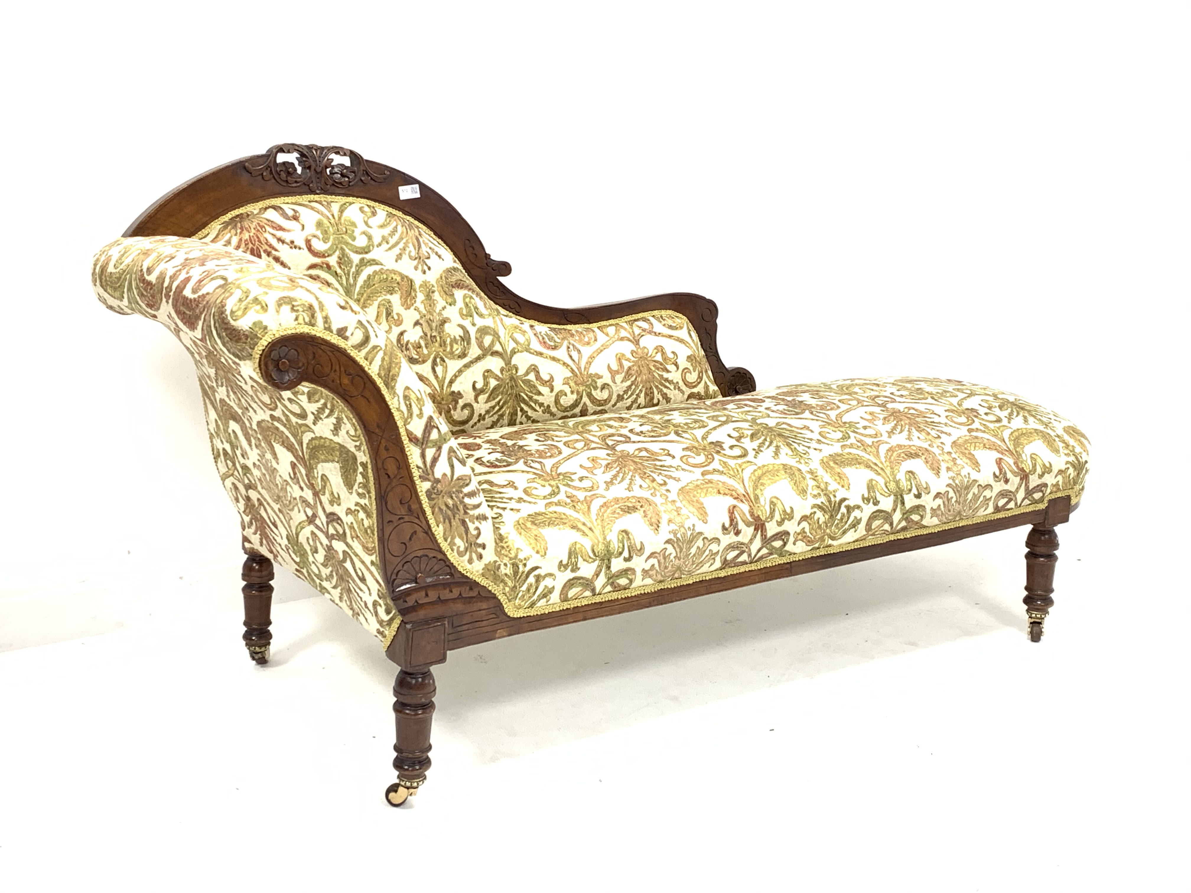 Late Victorian walnut chaise longue, with scroll ends and incised decoration, and carving to crest r