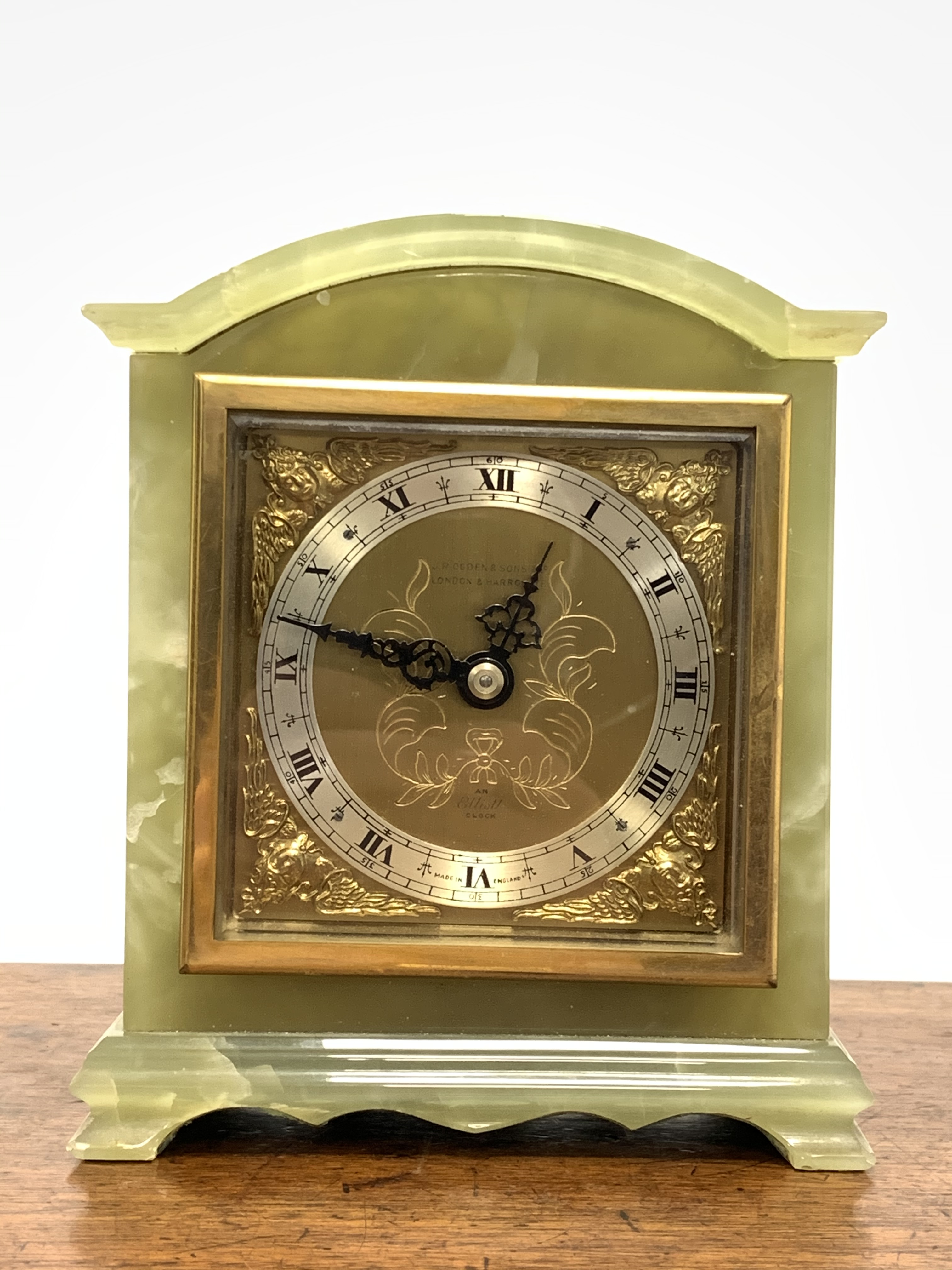 Elliot and Sons onyx cased mantel clock, Silvered dial with Roman chapter ring, retailed by J R Ogde