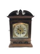 Late 19th century mantle clock in architectural walnut case, arched pediment with central leaf carve