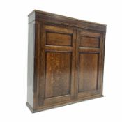 19th century oak cupboard, mahogany banded frieze with string inlay over two panelled doors revealin