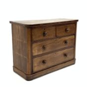 Victorian mahogany chest fitted with two short and two long drawers, with rounded corners, turned ha