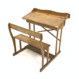 Mid 20th century child's school desk, raised back over ink well recess and pen wells, sloped front r