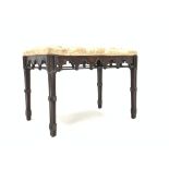 Victorian mahogany duet stool of Gothic design, with upholstered seat over arch carved apron, raised