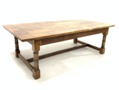 Large solid oak refectory style dining table, raised on ring turned and block supports united by 'H'