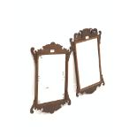 Edwardian burr walnut framed wall hanging mirror with decorative pediment and apron, (66cm x 38cm) t