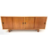 Mid 20th century retro teak Vintage sideboard in the style of Robin Day, with four sliding doors enc