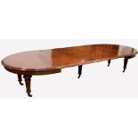 Large Victorian mahogany extending dining table, 'D' ended, with four additional leaves, raised on t