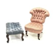 Victorian walnut framed deep buttoned salon chair, upholstered in pink floral fabric, raised on turn