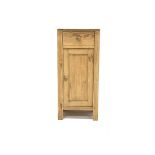 Stripped pine bedside cupboard, with marble top over one drawer and panelled cupboard enclosing a sh