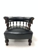 Late 19th century tub shaped library chair, leather upholstered back raised on turned spindle galle